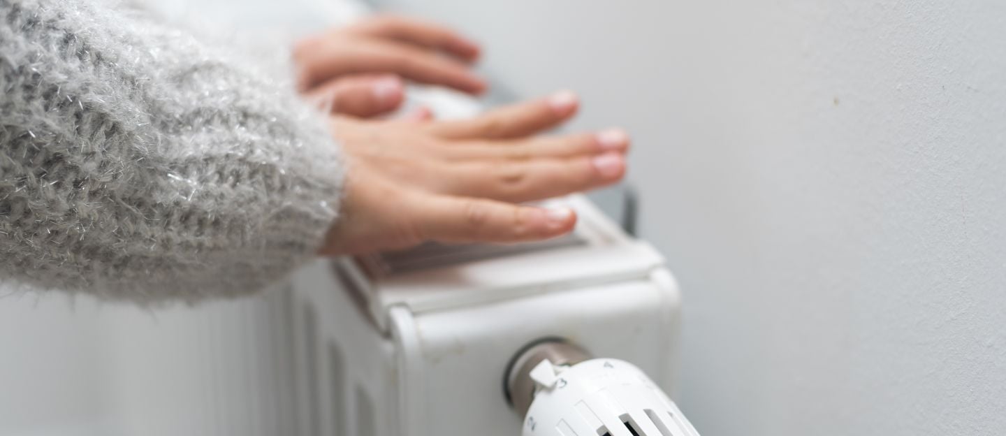 The,Child&#8217;s,Hands,Warm,Their,Hands,Near,The,Heating,Radiator.