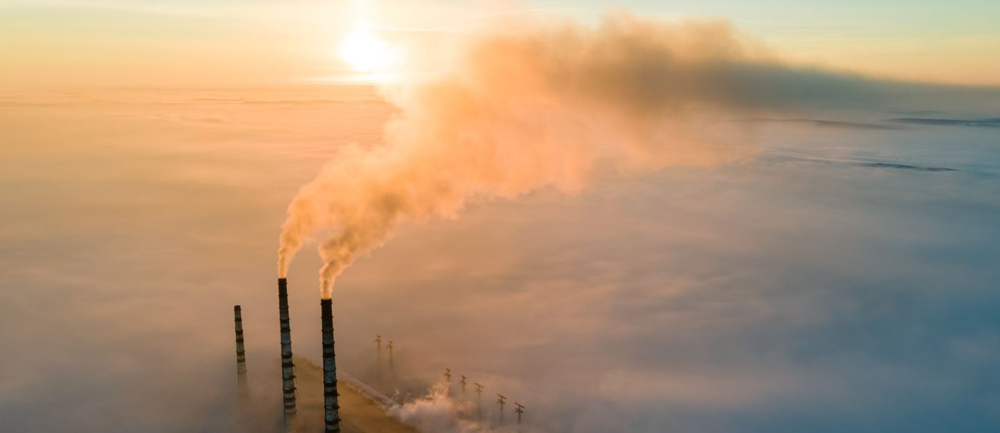 Aerial,View,Of,Coal,Power,Plant,High,Pipes,With,Black