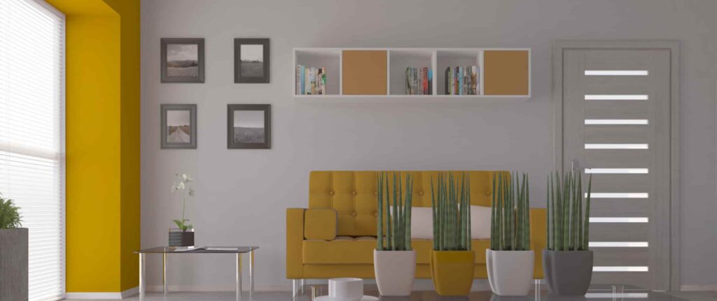 ruang tamu dengan kombinasi dinding abu-abu dan furnitur kuning mustard